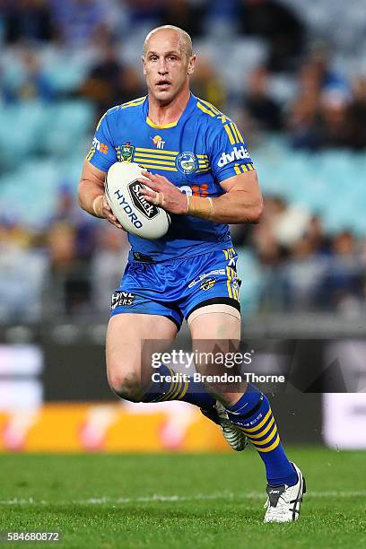 Jeff Robson of the Eels runs the ball during the round 21 NRL match between the Parramatta Eels and the Wests Tigers at ANZ Stadium on July 30, 2016...