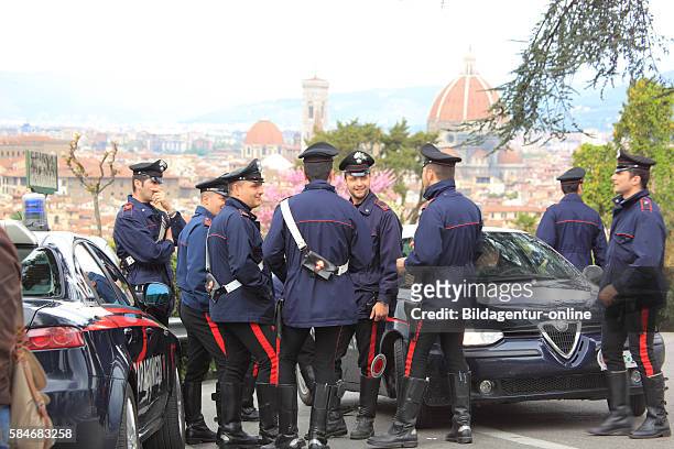 Italian Carabinieri policemen with your Alfa Romeos, here in Firenze, Florence, Tuscany, Italy .