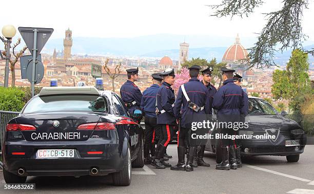 Italian Carabinieri policemen with your Alfa Romeos, here in Firenze, Florence, Tuscany, Italy .