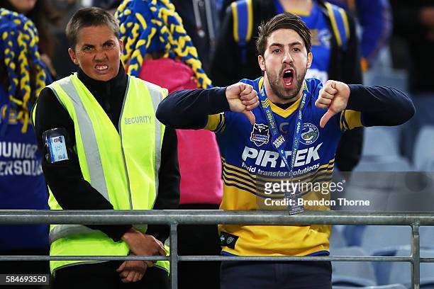 An Eels fan gestures towards the Referees following the round 21 NRL match between the Parramatta Eels and the Wests Tigers at ANZ Stadium on July...