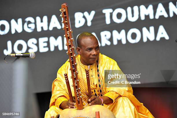 Toumani Diabate performs Songhai on the Open Air Stage during Day 3 of the Womad Festival stage at Charlton Park on July 30, 2016 in Wiltshire,...