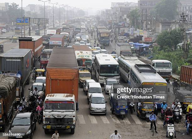 Heavy traffic jam from Rajeev Chowk to Sohna at NH8 due to heavy rainfall, as more than 150 vehicles broke-down on the highway due to water entering...