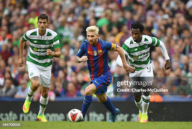 Lionel Messi of Barcelona and Efe Ambrose of Celtic during the International Champions Cup series match between Barcelona and Celtic at Aviva Stadium...