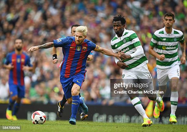 Lionel Messi of Barcelona and Efe Ambrose of Celtic during the International Champions Cup series match between Barcelona and Celtic at Aviva Stadium...