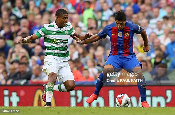 Barcelona's Uruguayan forward Luis Suarez vies with Celtic's Swiss defender Saidy Janko during the pre-season International Champions Cup football...