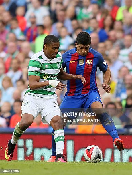 Barcelona's Uruguayan forward Luis Suarez vies with Celtic's Swiss defender Saidy Janko during the pre-season International Champions Cup football...