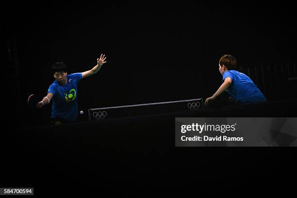 Olympic table tennis players LI Xiaoxia and Ding Ning of China practice at Riocentro Pavilion 3 on July 30, 2016 in Rio de Janeiro, Brazil.