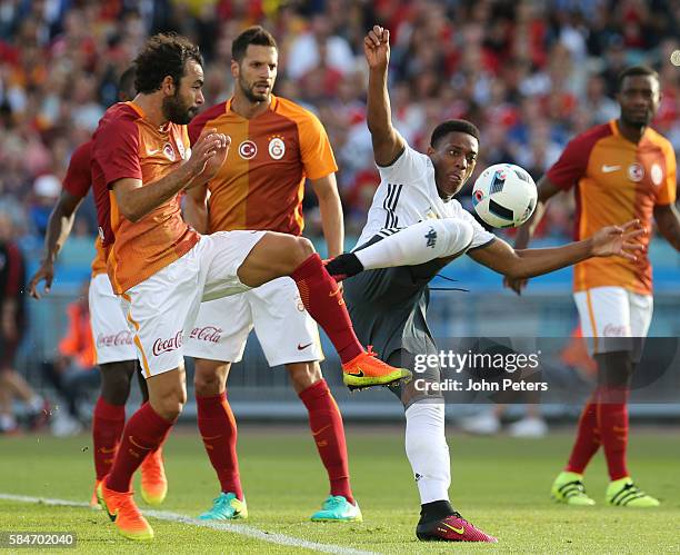 Anthony Martial of Manchester United in action with Selcuk Inan of Galatasary during the pre-season friendly match between Manchester United and...