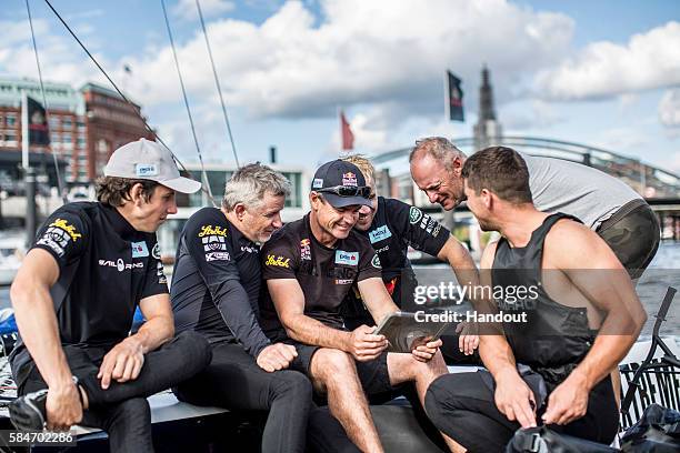 In this handout image provided by Red Bull, Austria's Red Bull Sailing Team crew Jeremy Bachelin, Roman Hagara, Darren Bundock, Brad Farrand, Hans...