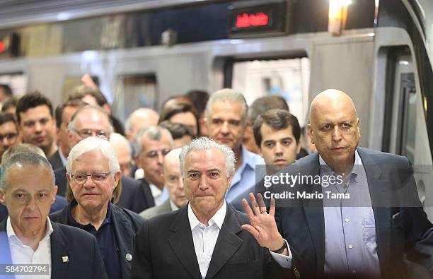 Brazil's interim President Michel Temer and Rio de Janeiro Governor Luiz Fernando de Silva depart after riding on the new Metro Line 4 subway train...