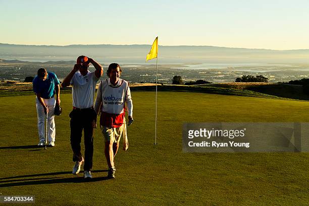 Maverick McNealy hugs his caddy and father Scott McNealy after finishing the second round of the Web.com Tour Ellie Mae Classic at TPC Stonebrae on...
