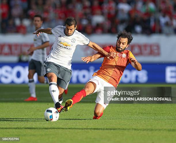 United's Henrikh Mkhitaryan vies with Galatasaray's Selcuk Inan during the Galatasaray v Manchester United pre-season friendly football match on...
