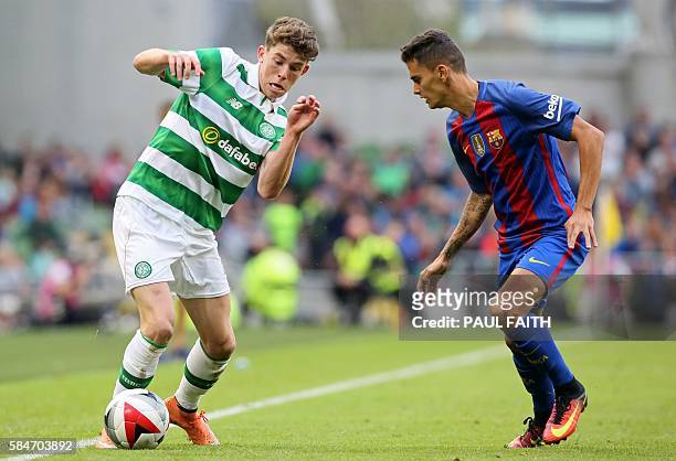 Celtic's Scottish midfielder Ryan Christie vies with Barcelona's Spanish defender Nili during the pre-season International Champions Cup football...