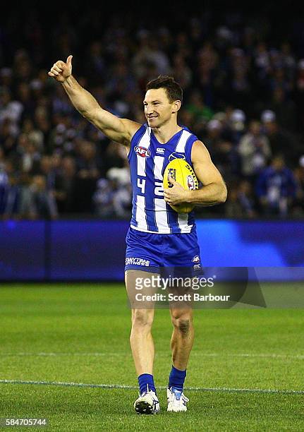 Brent Harvey of the Kangaroos gestures to the crowd as he leaves the field after the round 19 AFL match between the North Melbourne Kangaroos and the...