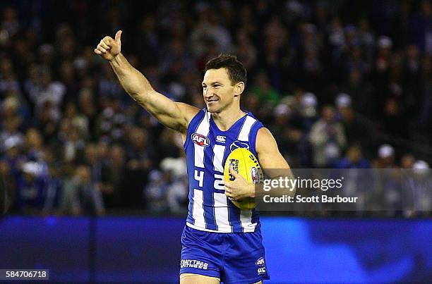 Brent Harvey of the Kangaroos gestures to the crowd as he leaves the field after the round 19 AFL match between the North Melbourne Kangaroos and the...