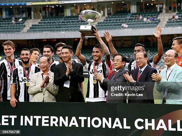 Captain Roberto Pereyra of Juventus FC holds the trophy after the match between Juventus FC and South China of Hong Kong at Hong Kong Stadium on July...