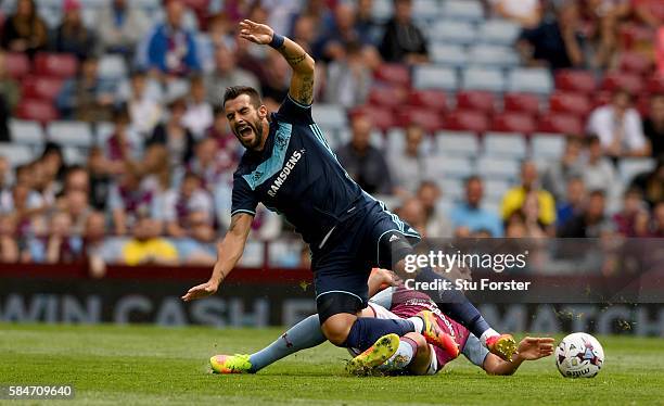 Middesbrough forward Alvaro Negredo is fouled by Tommy Elphick of Villa during the pre- season friendly between Aston Villa and Middlesbrough at...