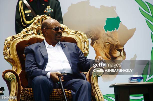 Sudanese President Omar al-Bashir takes part in a ceremony in his honour upon his return in the country from Ethiopa on July 30, 2016 in the capital...