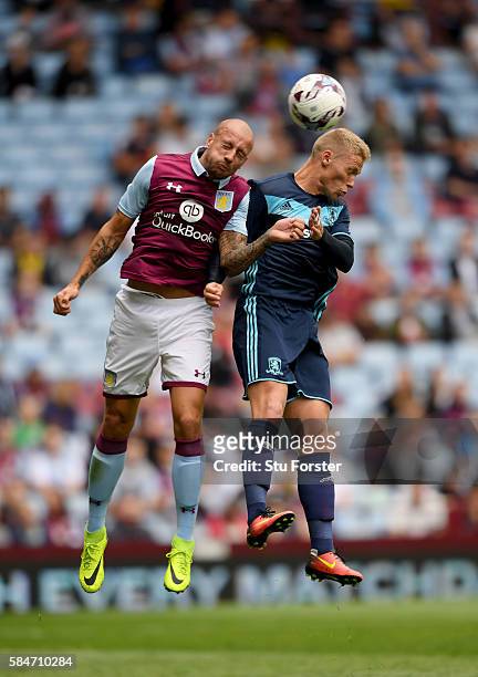 Middesbrough forward Viktor Fischer is challenged by Alan Hutton of Villa during the pre- season friendly between Aston Villa and Middlesbrough at...