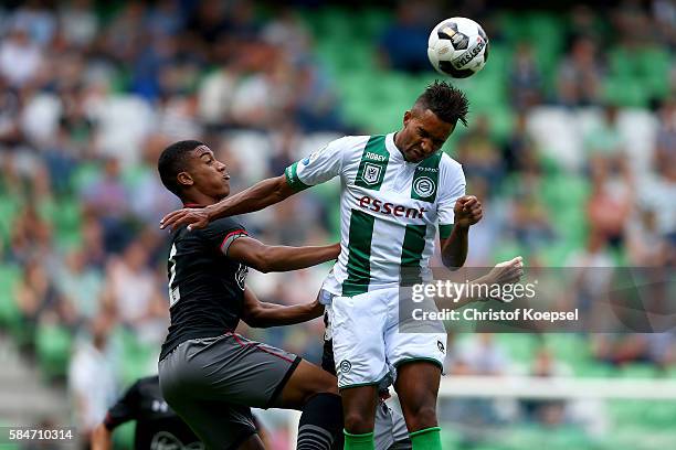 Yan Valery of Southampton and Danny Hoesen of Groningen go up for a header during the friendly match between FC Groningen an FC Southampton at...