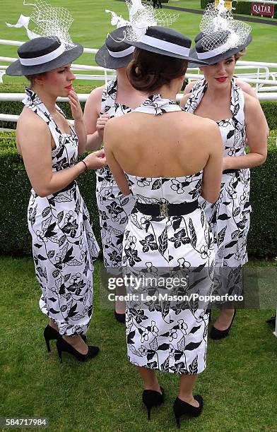 Ladies wear identical fashion outfits at Qatar Goodwood Festival 2016 Ladies Day Elle & The Pocket Belles group at Goodwood on July 28, 2016 in...