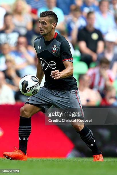 Dusan Tadicof Southampton runs with the ball during the friendly match between FC Groningen an FC Southampton at Euroborg Stadium on July 30, 2016 in...