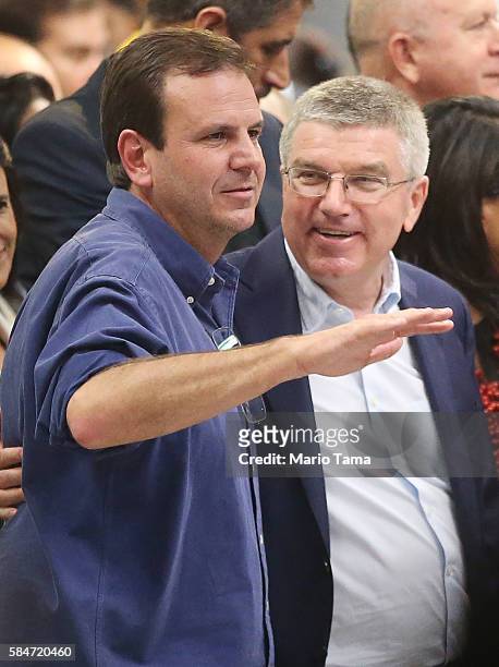 International Olympic Committee President Thomas Bach chats with Rio de Janeiro Mayor Eduardo Paes at an event inaugurating the new Metro Line 4...