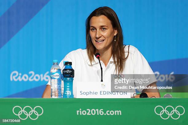 Sophie Edington speaks to the media at the Olympic Refugee Team Press Conference during the Olympics preview day - 6 at the Barra Olympic Park on...