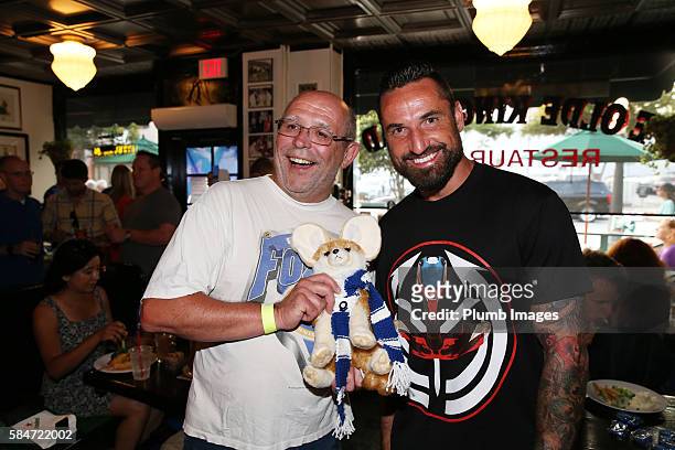Leicester City's Marcin Wasilewski meet local fans in Ye Olde Kings Head pub in Los Angeles during their Pre-Season US Tour on July 29, 2016 in Los...
