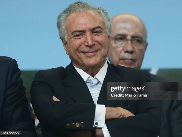 Brazil's interim President Michel Temer smiles during an event inaugurating a new subway line July 30, 2016 in Rio de Janeiro, Brazil. After many...