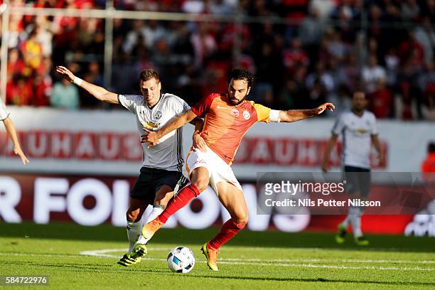 Selçuk nan of Galatasaray and Morgan Schneiderlin of Manchester United competes for the ball during the pre-season Friendly between Manchester United...