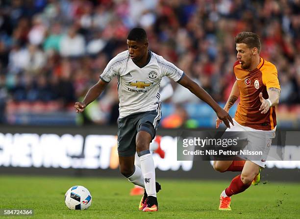Marcus Rashford of Manchester United and Hamit Altntop of Galatasaray during the pre-season Friendly between Manchester United and Galatasaray at...