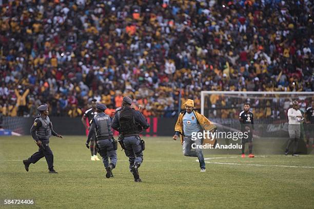 Fan of Kaiser Chiefs enters field as he celebrates the victory during 2016 Carling Black Label Cup between Kaizer Chiefs F.C. And Orlando Pirates at...