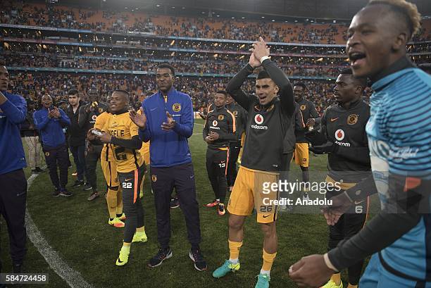 Footballers of Kaiser Chiefs celebrate their victory at the end of the 2016 Carling Black Label Cup between Kaizer Chiefs F.C. And Orlando Pirates at...