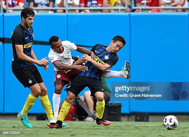 Julian Green of FC Bayern Munich ties up with Yuto Nagatomo of FC Internazionale during an International Champions Cup match at Bank of America...