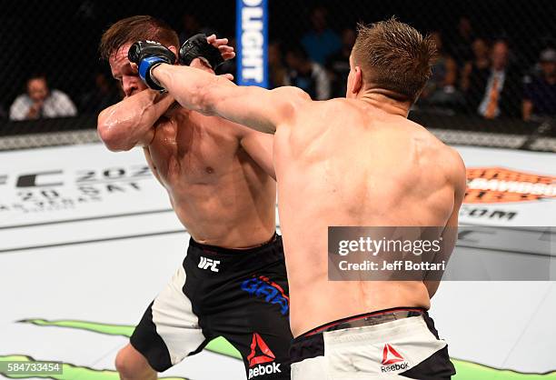 Bojan Velickovic punches Michael Graves in their welterweight bout during the UFC 201 event on July 30, 2016 at Philips Arena in Atlanta, Georgia.