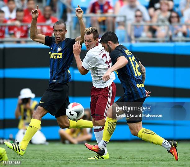 Karl-Heinz Lappe of FC Bayern Munich squeezes between Miranda and Daniel Bessa of FC Internazionale during an International Champions Cup match at...