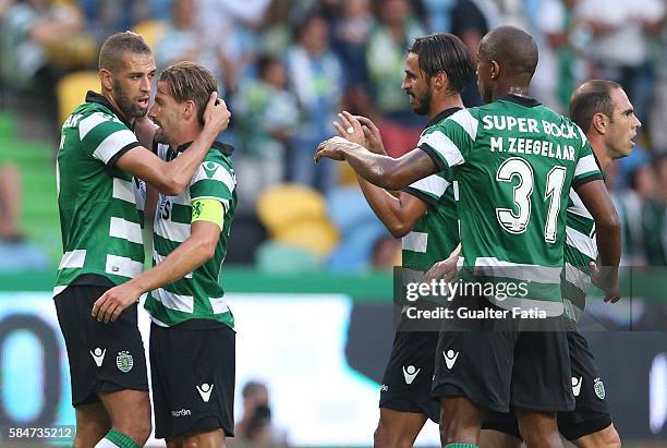 Sporting CP's forward Islam Slimani from Algeria celebrates with teammate Sporting CP's midfielder Adrien Silva after scoring a goal during the Pre...