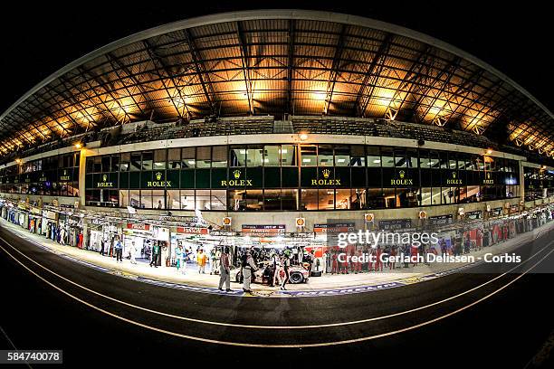 Clearwater Racing , #61 Ferrari 458 Italia, with Drivers Mok Weng Sun , Keita Sawa and Robert Bell in the pit lane during the 84th running of the Le...