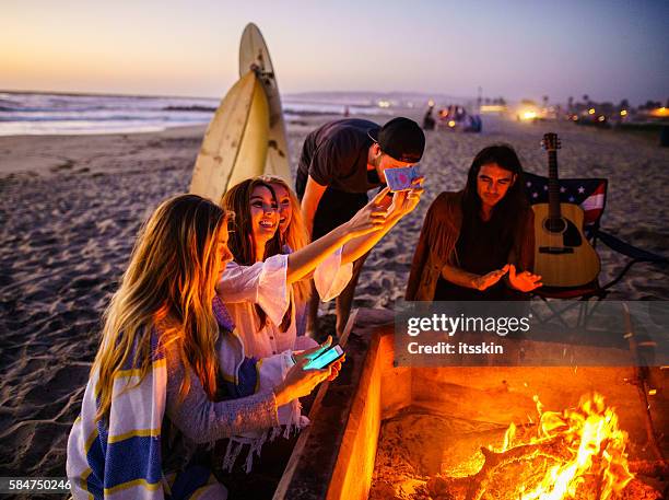 friends having fun at san diego beach - girl fire woman stock pictures, royalty-free photos & images