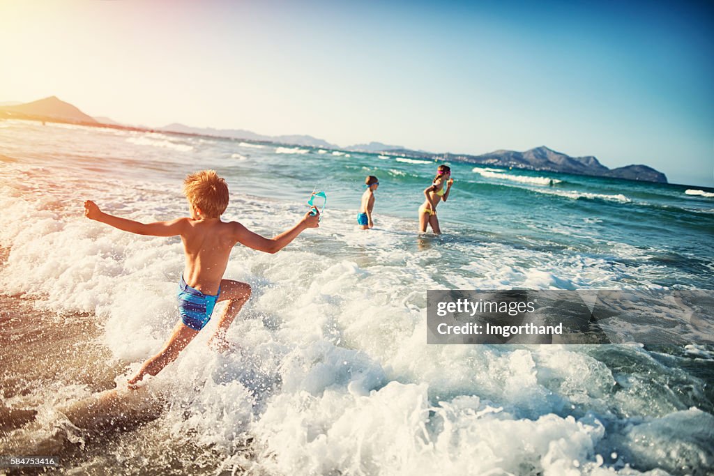 Summer vacations - kids playing at sea