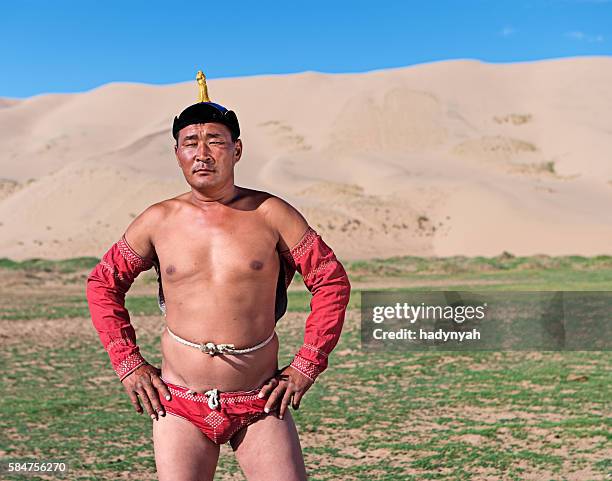 mongolian wrestler posing during naadam festival - nadaam festival stock pictures, royalty-free photos & images