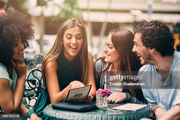 Friends Looking 1,375 Friends Looking At Menu Stock Photos, High-Res Pictures, and ...