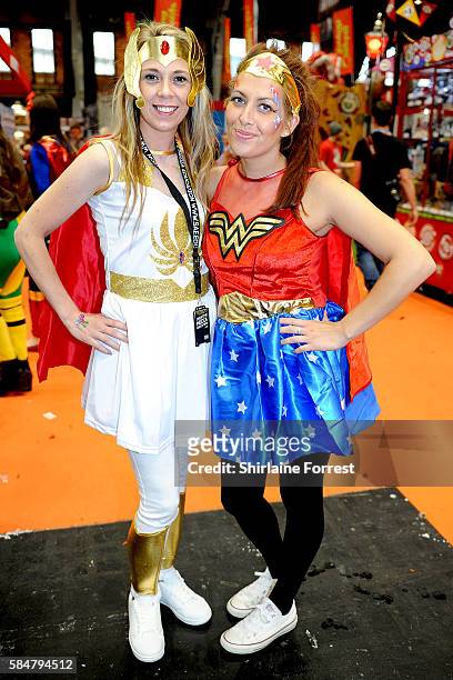 Cosplayers dressed as She-Ra and Wonder Woman attend MCM Comic Con at Manchester Central on July 30, 2016 in Manchester, England.