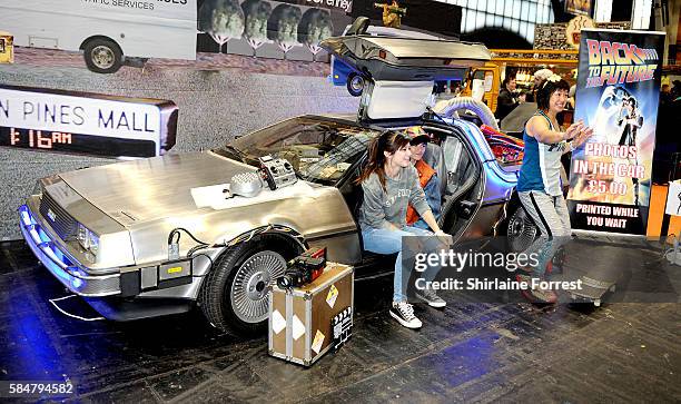 Cosplayer dressed as Marty McFly poses with a Delorean while attending MCM Comic Con at Manchester Central on July 30, 2016 in Manchester, England.