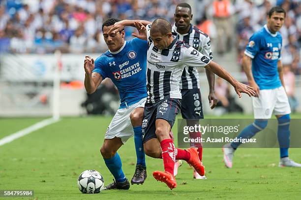 Aldo Ramirez of Cruz Azul fights for the ball with Walter Gargano of Monterrey during the 3rd round match between Monterrey and Cruz Azul as part of...