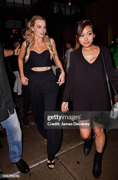 Margot Robbie and Karen Fukuhara seen on the streets of Manhattan on July 30, 2016 in New York City.