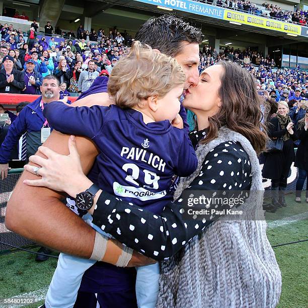 Matthew Pavlich of the Dockers is greeted by his wife Lauren and children Harper and Jack before walking out onto the field to play his 350th game...