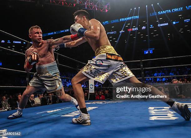 Leo Santa Cruz of Mexico fights Carl Frampton of Northern Ireland during their 12 round WBA Super featherweight championship bout at Barclays Center...