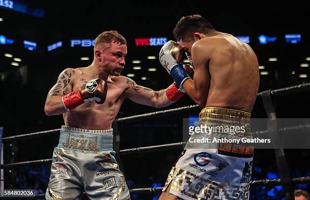 Leo Santa Cruz of Mexico fights Carl Frampton of Northern Ireland during their 12 round WBA Super featherweight championship bout at Barclays Center...